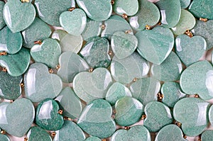 Green aventurine heart stones pile