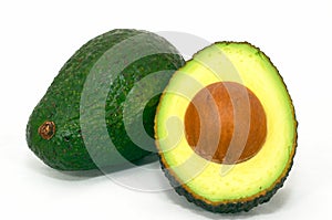 Green Avocado and cut avocado