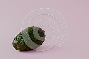 Green avocado pattern on pink background. Pop art design, creative summer food concept. Organic avocadoes in minimal flat lay