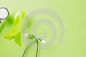 Green awareness ribbon and doctor stethoscope symbol of Gallbladder and Bile Duct Cancer month