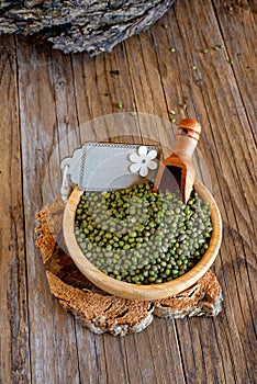 Green azuki beans on wooden table