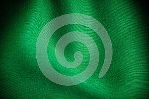 Green background abstract cloth wavy folds of textile texture