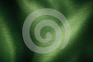 Green background abstract cloth wavy folds of textile texture