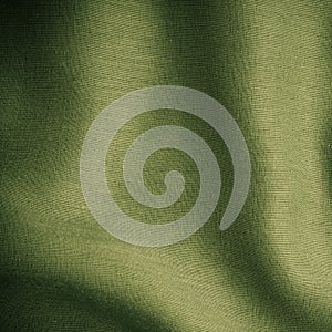 Green background abstract cloth wavy folds of textile texture