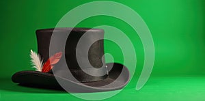 Green background, close up of a Bavarian hat, single feather accent , tyrolean, folk photo