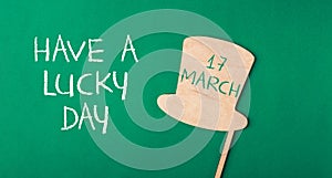 A green background with a hat on it