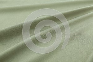 Green background luxury cloth or wavy folds of grunge silk texture satin velvet