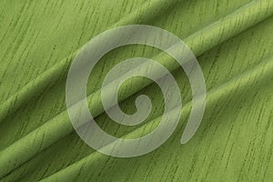 Green background luxury cloth or wavy folds of grunge silk texture satin velvet