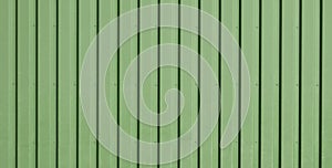 Green background of metal wall siding, cladding.