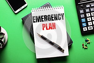 On a green background - a telephone, a calculator and a diary with the inscription EMERGENCY PLAN