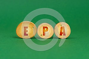 On a green background, wooden roundels with the inscription - EPA