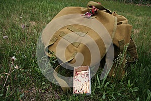 Green Backpack and box of Matches Survival Equipment Wild Camping Nature Wilderness Outdoor Northern Forest, America, Canada