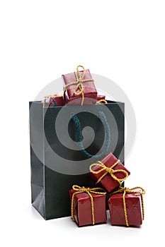 Green bag with small christmas present box