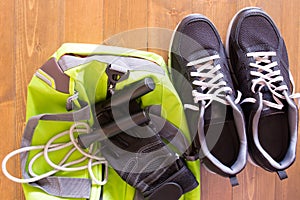 Green bag for sporting things on a wooden background