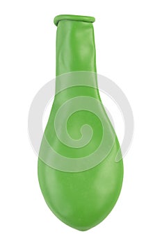 Green balloon without air. New colorful balloon isolated on white background. Object for birthday party decor