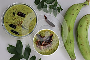 Green banana curry or plantain curry prepared in Kerala style with grated coconut and spices