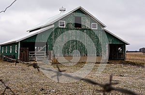 Green barn after a morning dusting