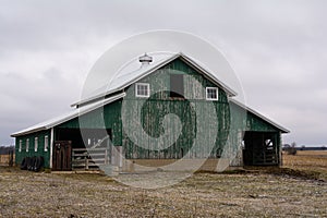 Green barn after a morning dusting