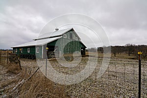 Green barn after a morning dusting