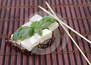 Green basilicas and chees on toast.