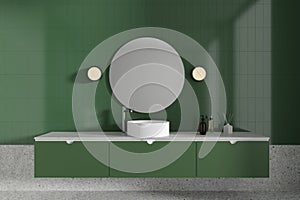 Green bathroom interior with sink and mirror
