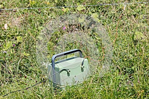 Green battery powering an electric fence