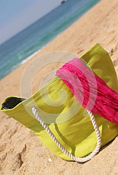 Green beach bag on the beach