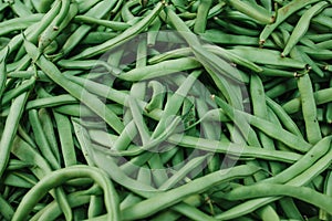 Green beans background. Natural local products on the farm market. Harvesting. Seasonal products. Food. Vegetables.
