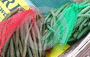 Green Beans Freshly Picked and Bagged in Colorful Mesh Sacks, for Sale at Farmer`s Market