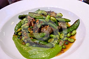 Green beans and pork served at bistrot in Paris photo