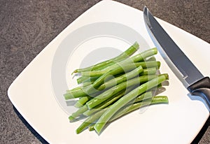Green beans on a white plate