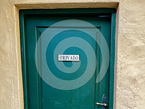 Green beautiful door in Tenerife, Spain. External wooden door. Privado main private photo