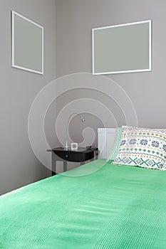 Green bed with bedside table