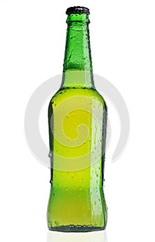 Green beer bottle with water drops