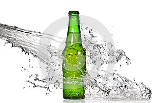 Green beer bottle with water splash