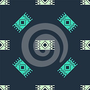 Green and beige Mexican carpet icon isolated seamless pattern on blue background. Vector