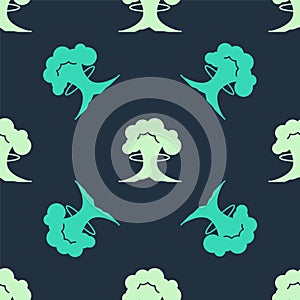 Green and beige Nuclear explosion icon isolated seamless pattern on blue background. Atomic bomb. Symbol of nuclear war