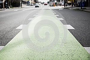 Green bicycle lane painted in street