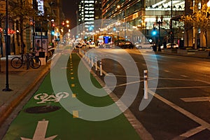 Green bike lane at night