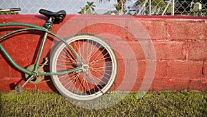 Green bike red wall