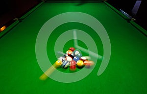 green billiard table with colorful Speedy balls