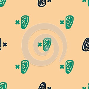 Green and black Deafness icon isolated seamless pattern on beige background. Deaf symbol. Hearing impairment. Vector