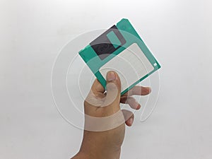 Green And Black Floopy Disk On White Background