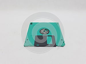 Green And Black Floopy Disk On White Background