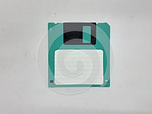 Green And Black Floopy Disk On White Background