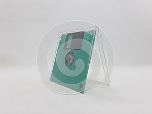 Green And Black Floopy Disk On White Background