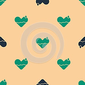 Green and black Heart heal icon isolated seamless pattern on beige background. Vector Illustration