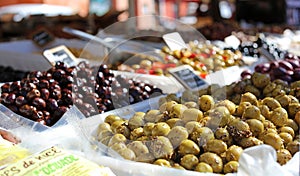 Green and black olives at a farmer market in France, Europe. Italian olive. Street French market at Nice.