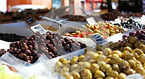 Green and black olives at a farmer market in France, Europe. Italian olive. Street French market at Nice.
