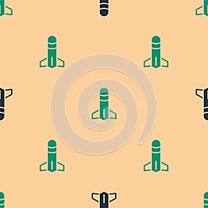 Green and black Rocket icon isolated seamless pattern on beige background. Vector